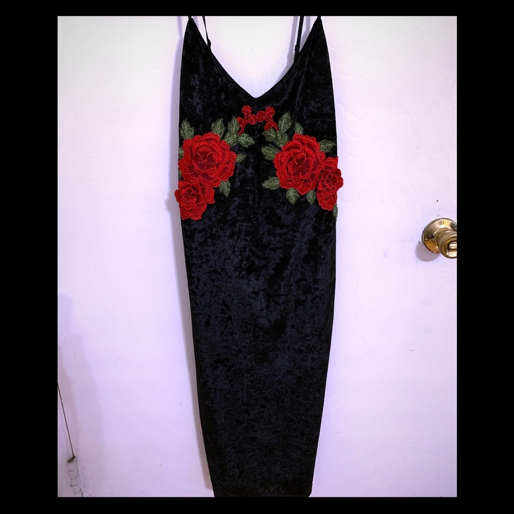 Velvet cocktail dress, red rose accents.